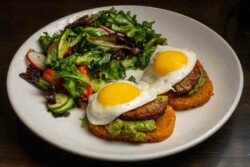Avocado salad, flat pork or turkey sausage, two eggs sunny side up, hash browns & salad