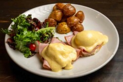 2 delicately poached eggs and silky hollandaise sauce; served with roasted garlic potatoes and fresh salad