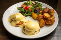 2 delicately poached eggs and silky hollandaise sauce; served with roasted garlic potatoes and fresh salad
