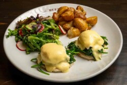 2 delicately poached eggs and silky hollandaise sauce; served with roasted garlic potatoes and fresh salad