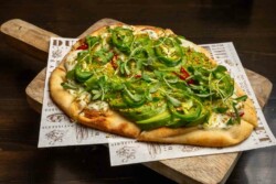 Homemade ricotta cheese spread with basil, avocado, jalapeno, yuzu sauce, cilantro, micro basil